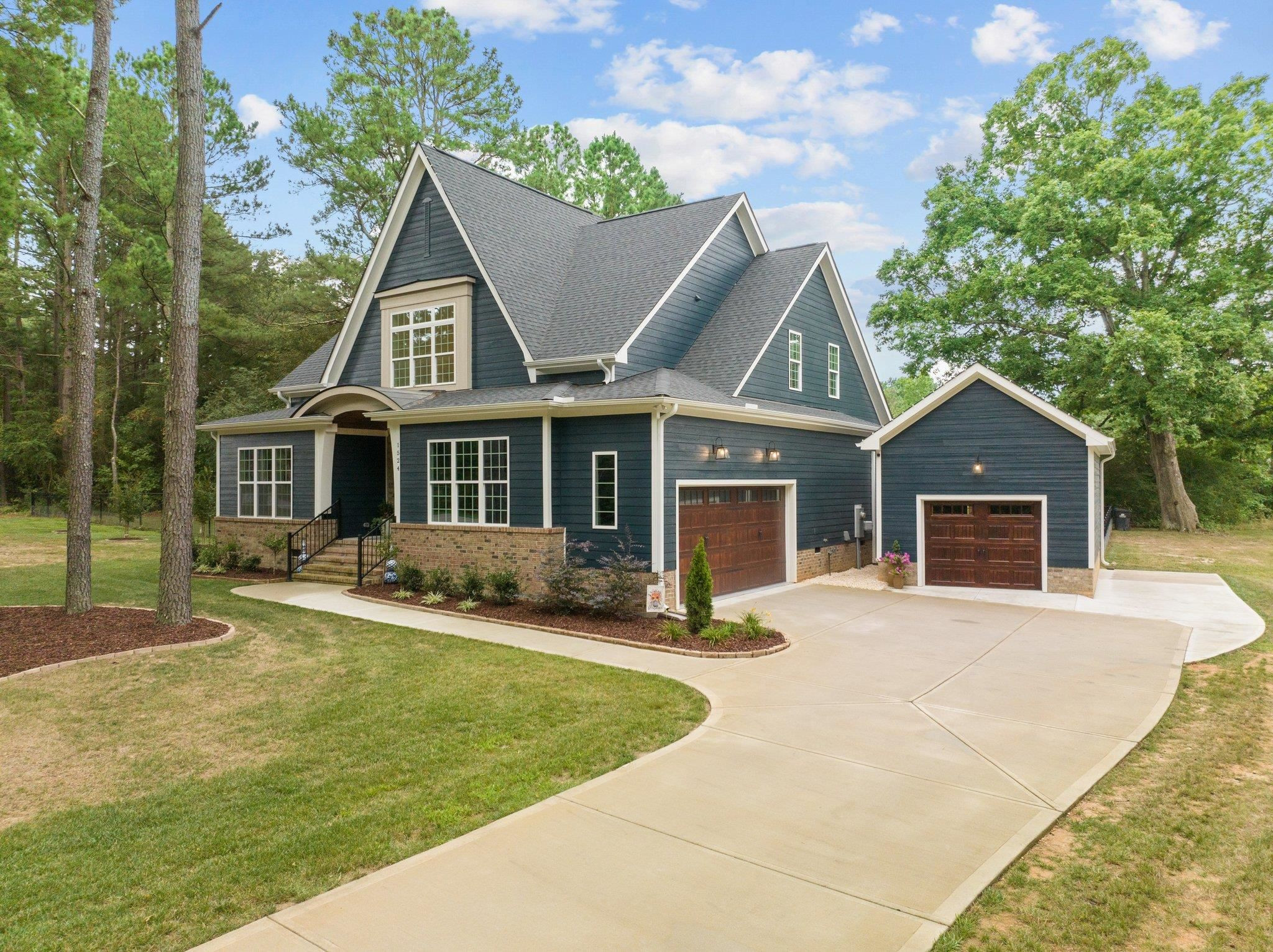 1524 Chalk Road Wake Forest, NC 27587 - Photo 5 of 63 front view of a house with a yard