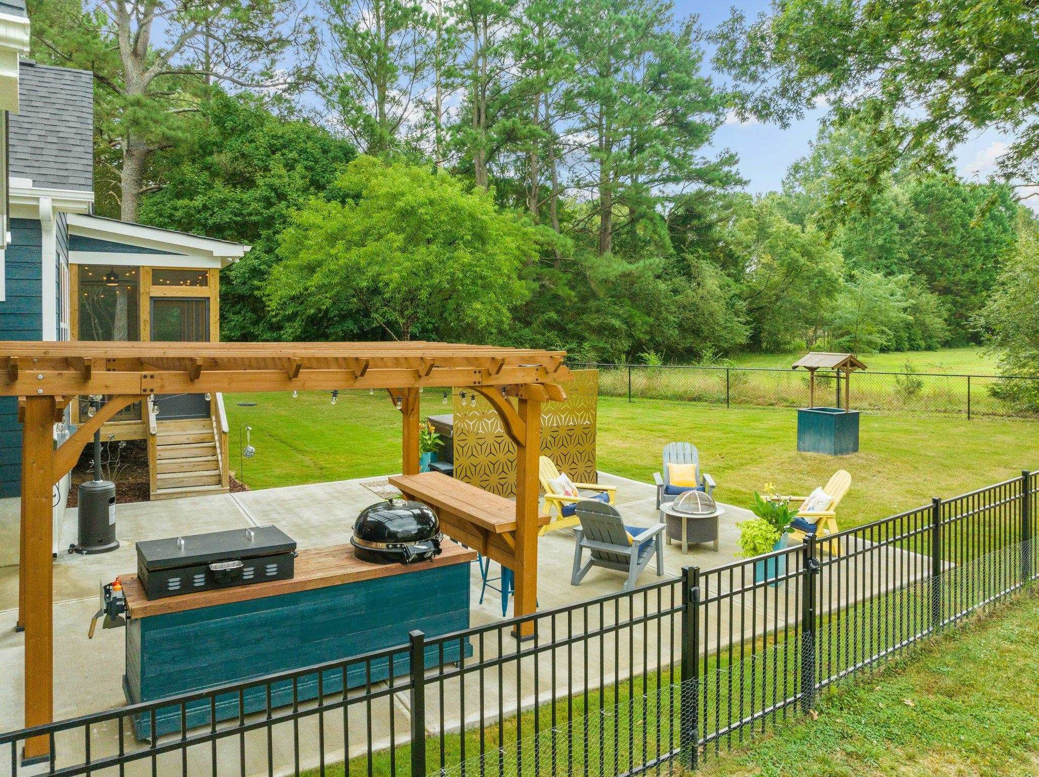 1524 Chalk Road Wake Forest, NC 27587 - Photo 55 of 63 a view of a patio with chairs and a table