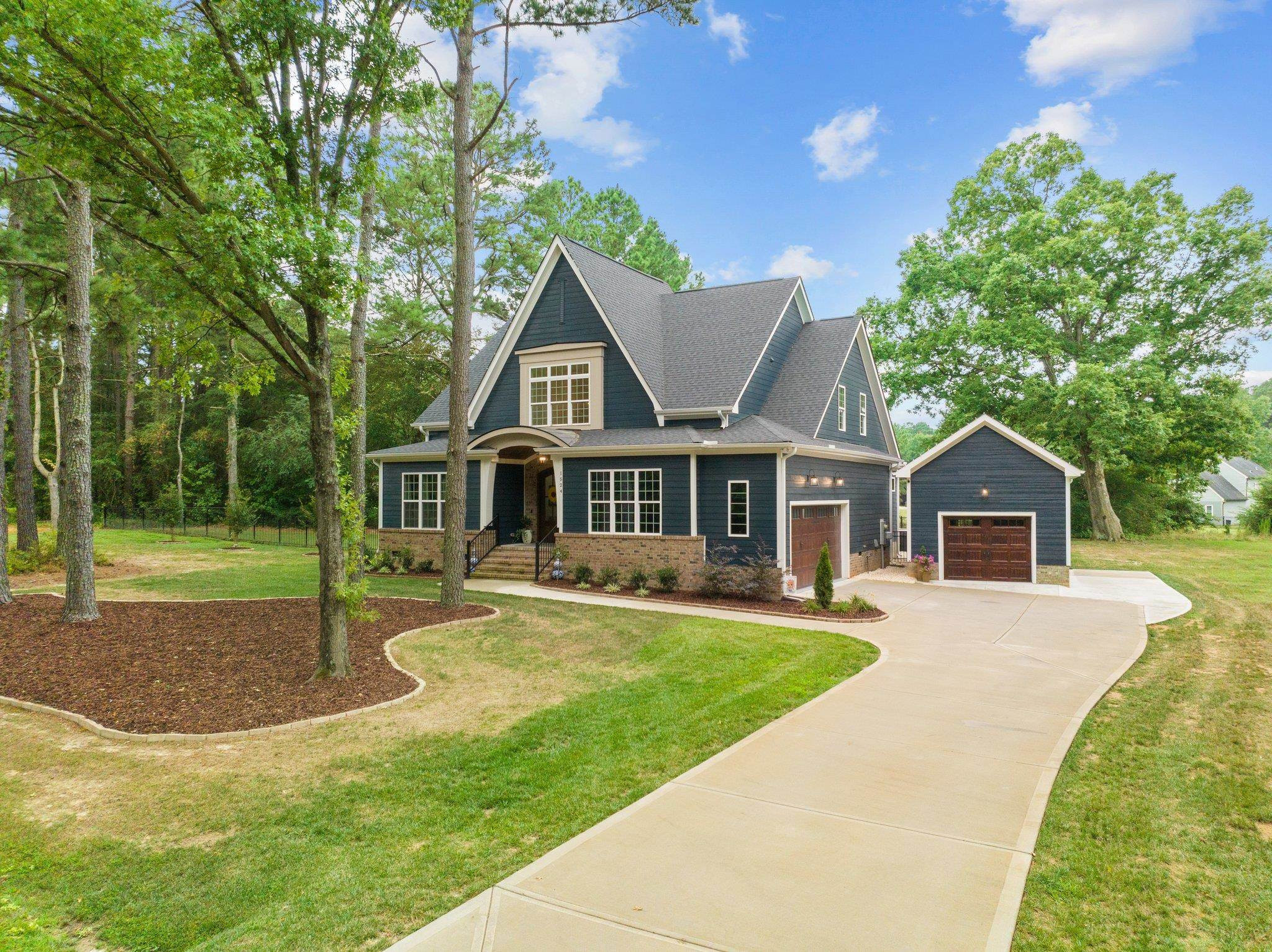 1524 Chalk Road Wake Forest, NC 27587 - Photo 59 of 63 a front view of a house with a yard