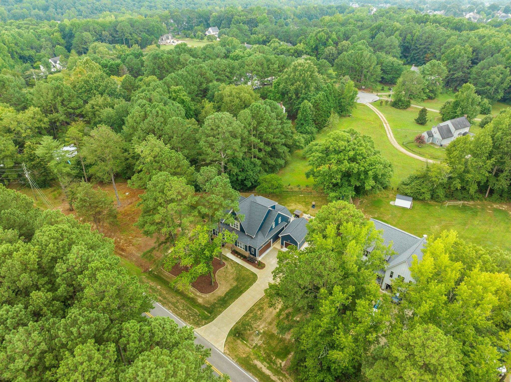 1524 Chalk Road Wake Forest, NC 27587 - Photo 60 of 63 an aerial view of residential house with outdoor space and trees all around