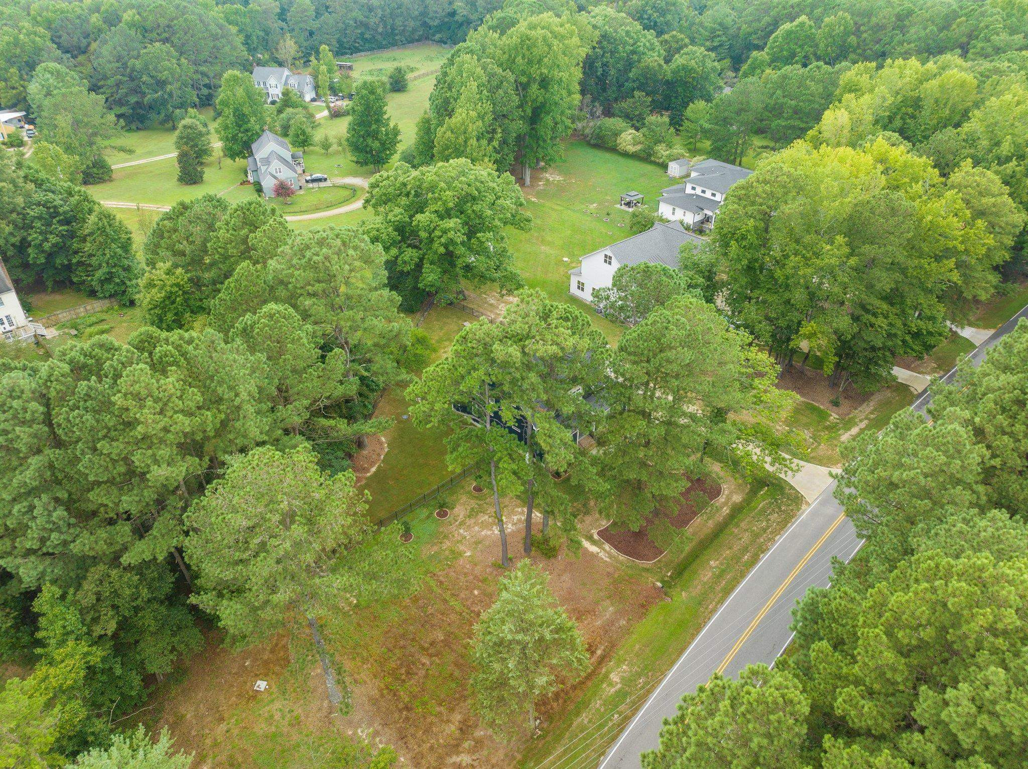 1524 Chalk Road Wake Forest, NC 27587 - Photo 61 of 63 a view of a garden with a lake