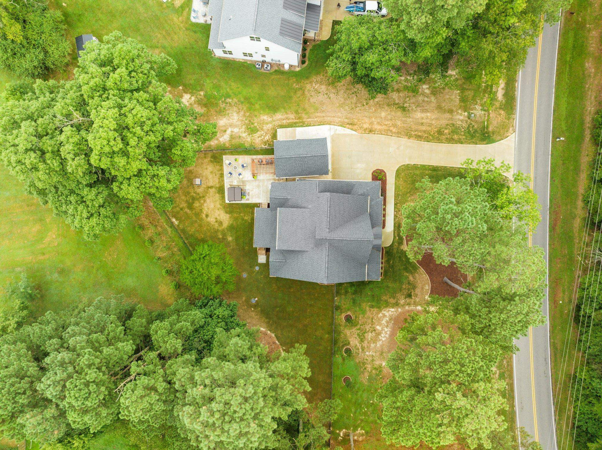 1524 Chalk Road Wake Forest, NC 27587 - Photo 63 of 63 an aerial view of residential houses with outdoor space and trees