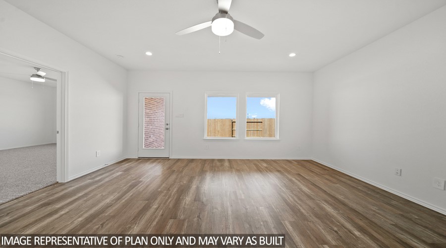 15767 Hanson Ridge Drive Montgomery, TX 77316 - Photo 7 of 21 an empty room with wooden floor and windows