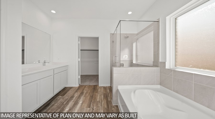 15767 Hanson Ridge Drive Montgomery, TX 77316 - Photo 8 of 17 a bathroom with a tub sink and mirror