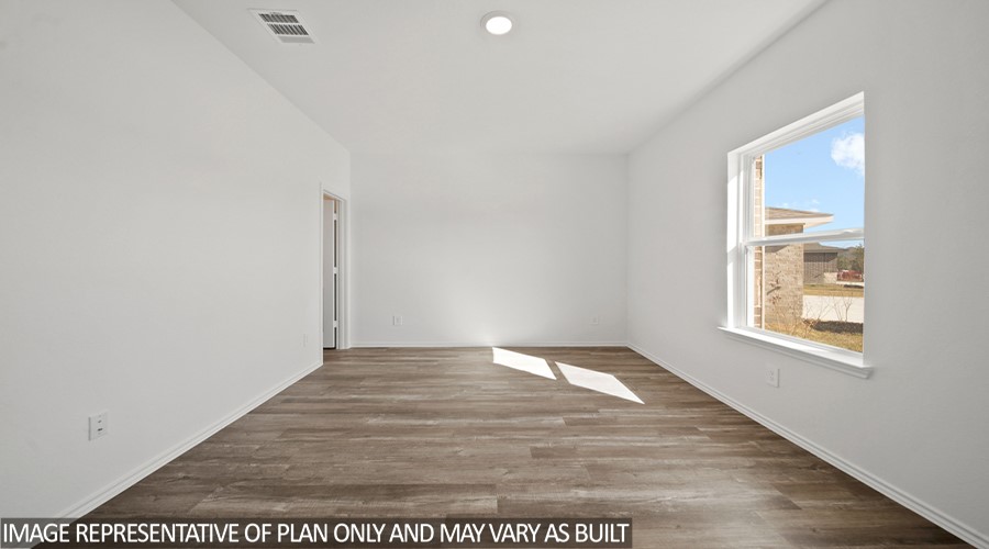 15767 Hanson Ridge Drive Montgomery, TX 77316 - Photo 10 of 17 a view of an empty room with wooden floor and a window
