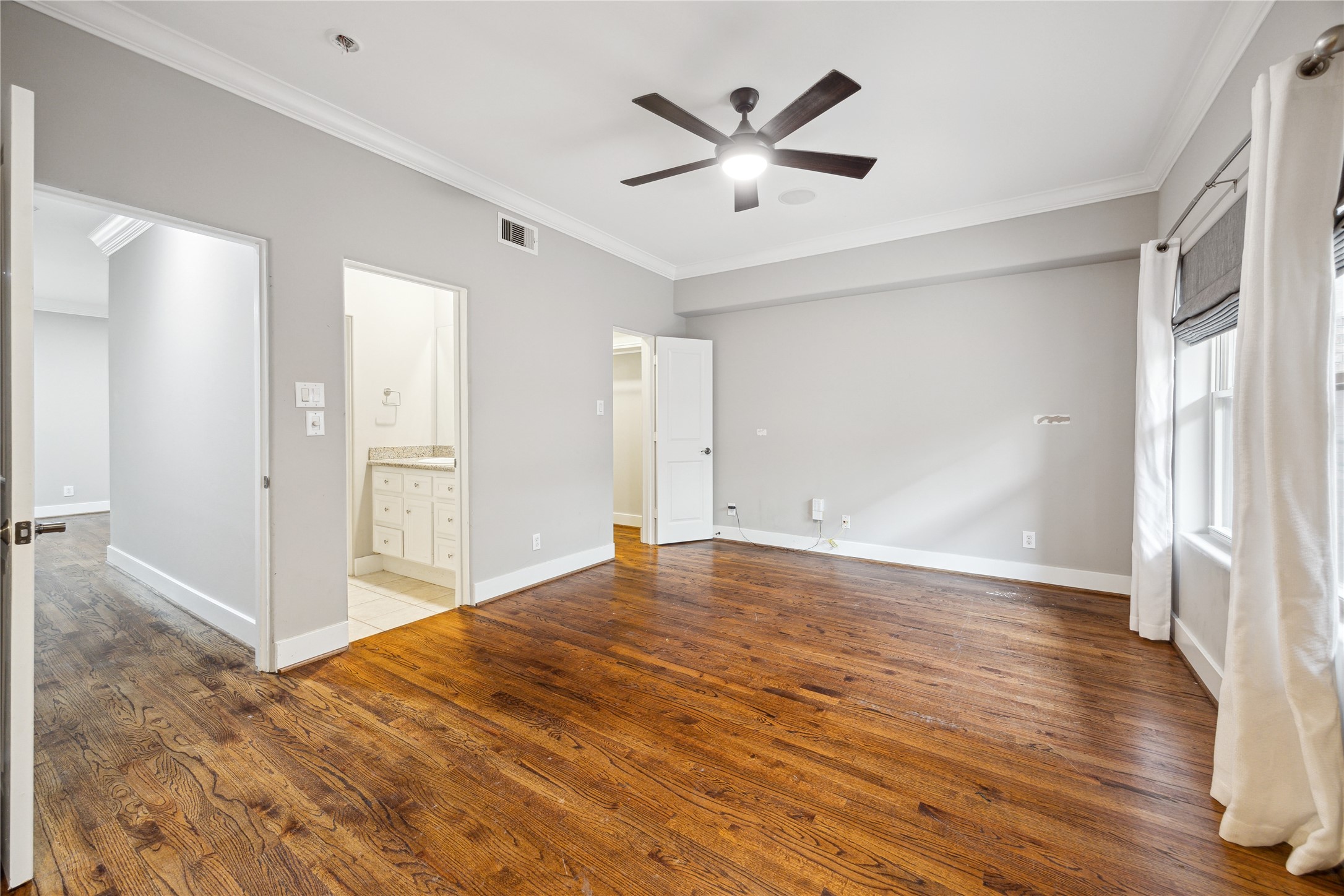 6310 Taggart Street, Unit B Houston, TX 77007 - Photo 23 of 37 wooden floor in an empty room with a window