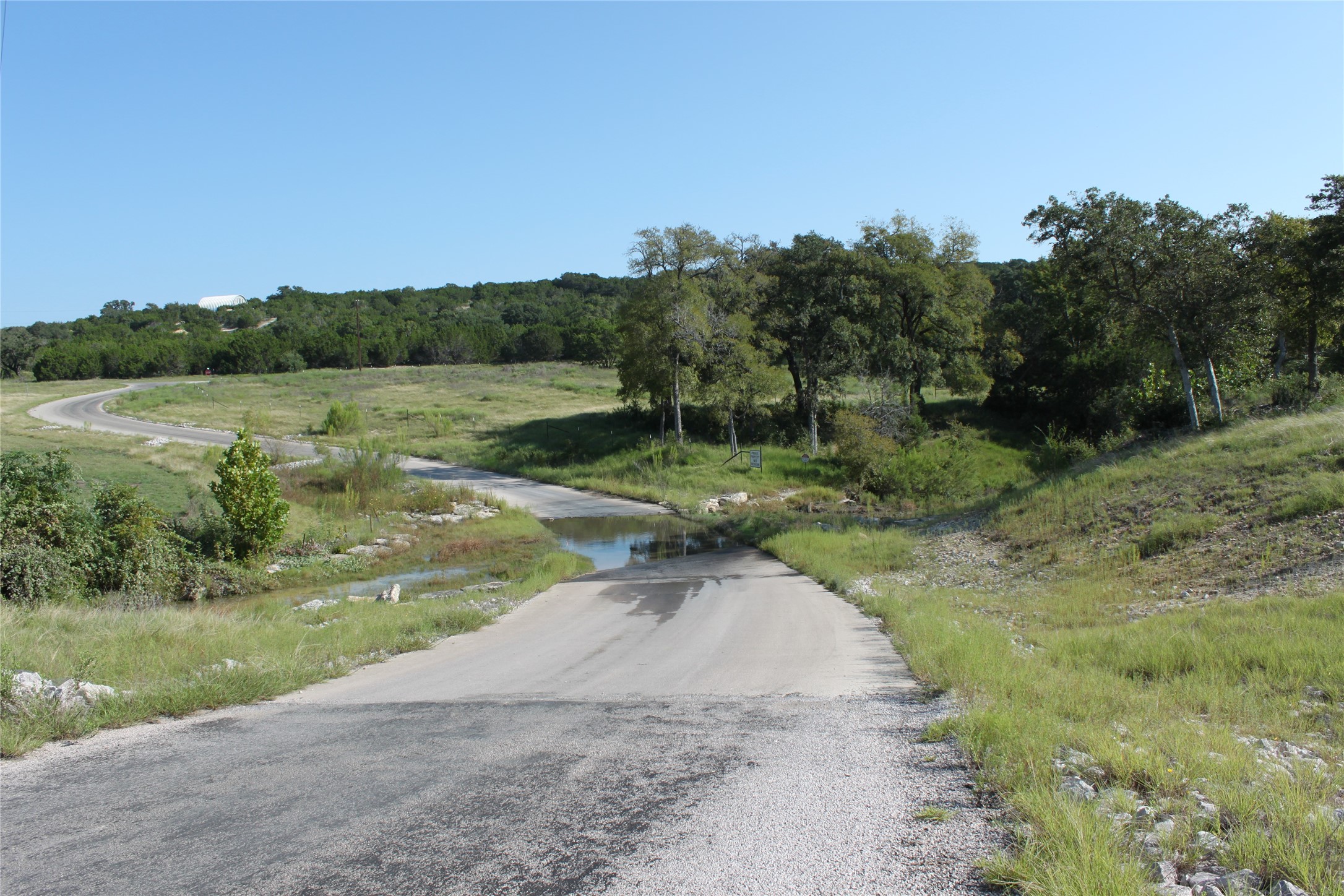 Lot 100 Saddle Ridge Drive Bertram, TX 78605 - Photo 13 of 27 a view of a street view with river and trees