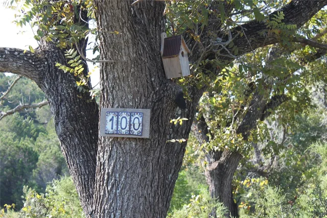 a sign that is on a tree