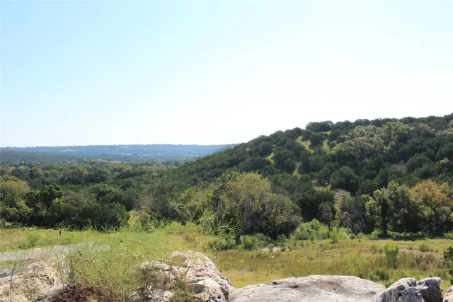 a view of a lake with a city