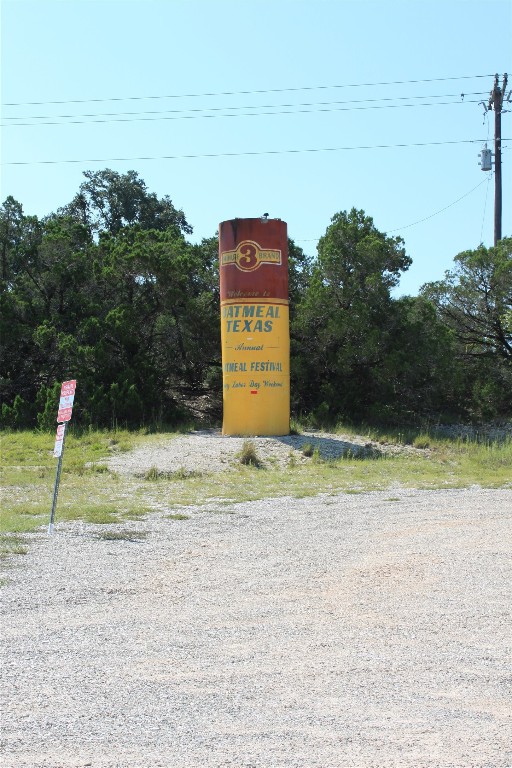 Lot 100 Saddle Ridge Drive Bertram, TX 78605 - Photo 27 of 27 a sign that is on the side of a road