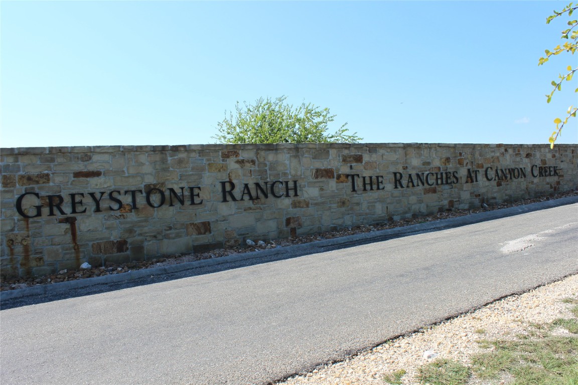 Lot 100 Saddle Ridge Drive Bertram, TX 78605 - Photo 5 of 27 a view of a street with a building in the background