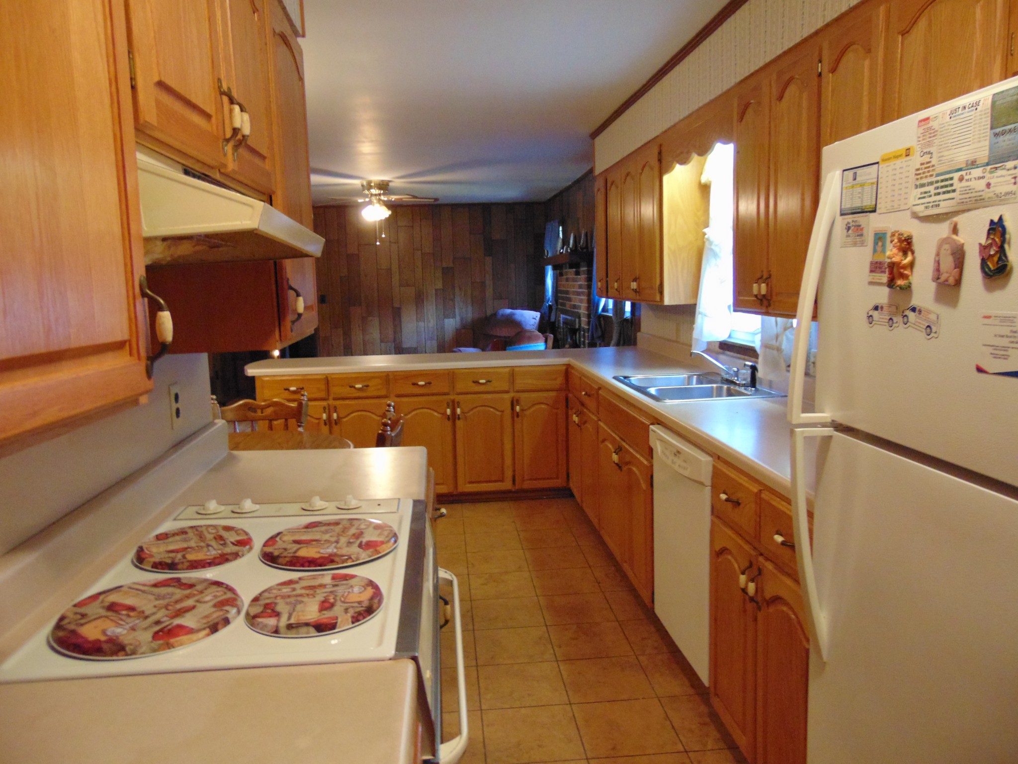 1704 Ann Road Lawrenceburg, TN 38464 - Photo 11 of 20 a large kitchen with stainless steel appliances granite countertop a sink and cabinets