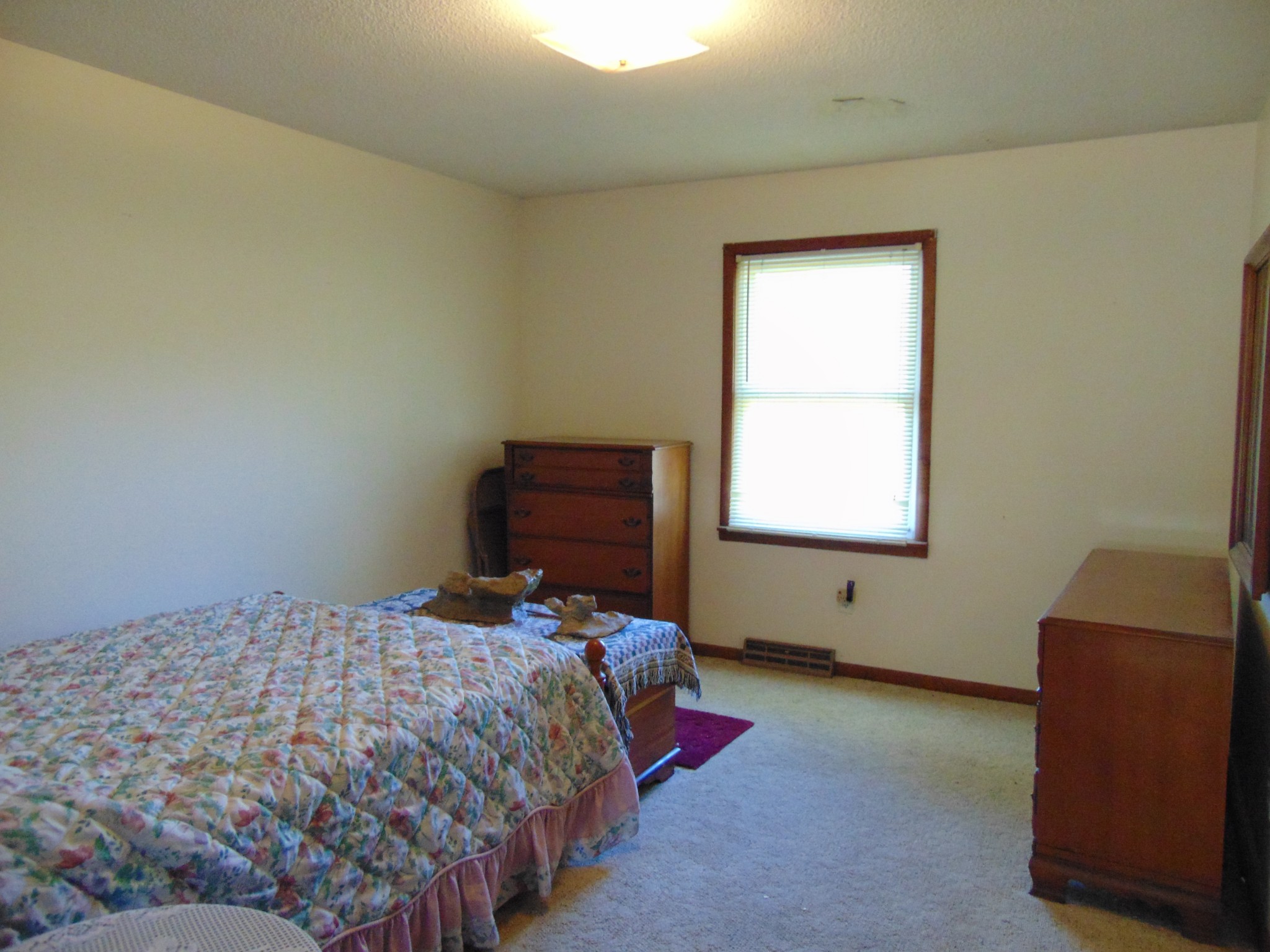 1704 Ann Road Lawrenceburg, TN 38464 - Photo 19 of 20 a bedroom with a bed and a chair