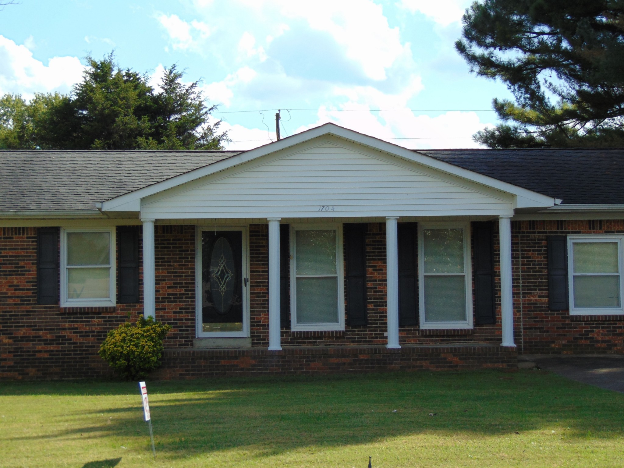 1704 Ann Road Lawrenceburg, TN 38464 - Photo 5 of 20 front view of a house with a yard