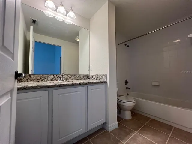 an empty room with wooden floor