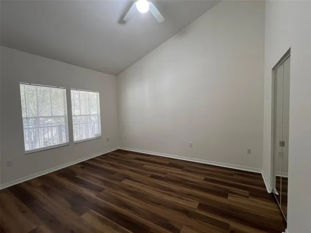 a view of room with window and hardwood floor