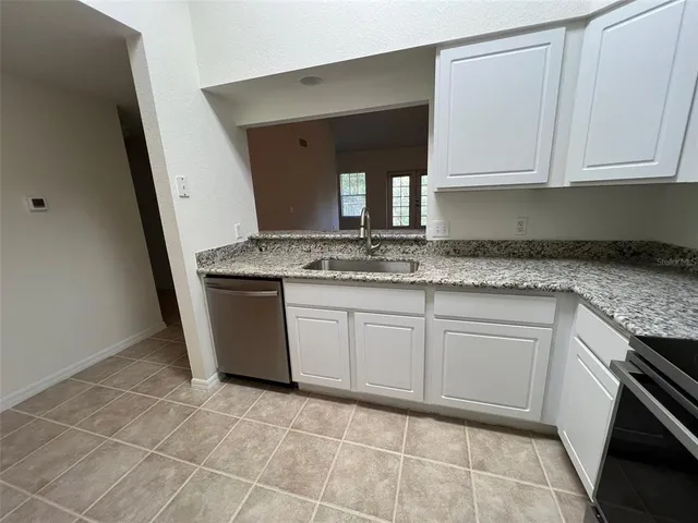 a kitchen with a stove microwave and refrigerator