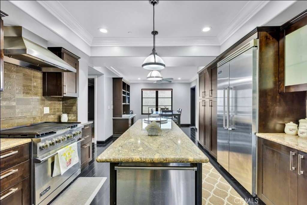 155 Cordova Street, Unit 203 Pasadena, CA 91105 - Photo 13 of 57 a kitchen with granite countertop stainless steel appliances a stove top oven a sink a counter space and cabinets