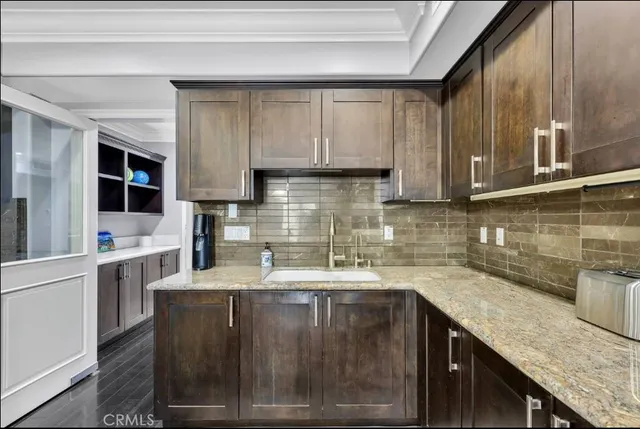 a kitchen with granite countertop stainless steel appliances lots of counter top space