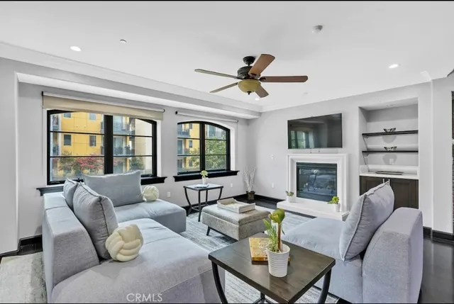 a room with furniture pool table and flat screen tv
