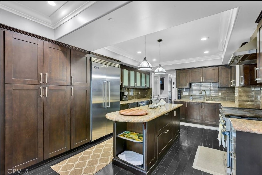 155 Cordova Street, Unit 203 Pasadena, CA 91105 - Photo 19 of 57 a kitchen with a table chairs refrigerator and microwave