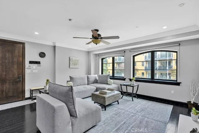 a living room with furniture and windows