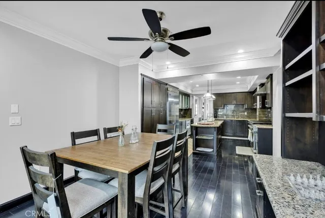 a kitchen with granite countertop stainless steel appliances lots of counter top space