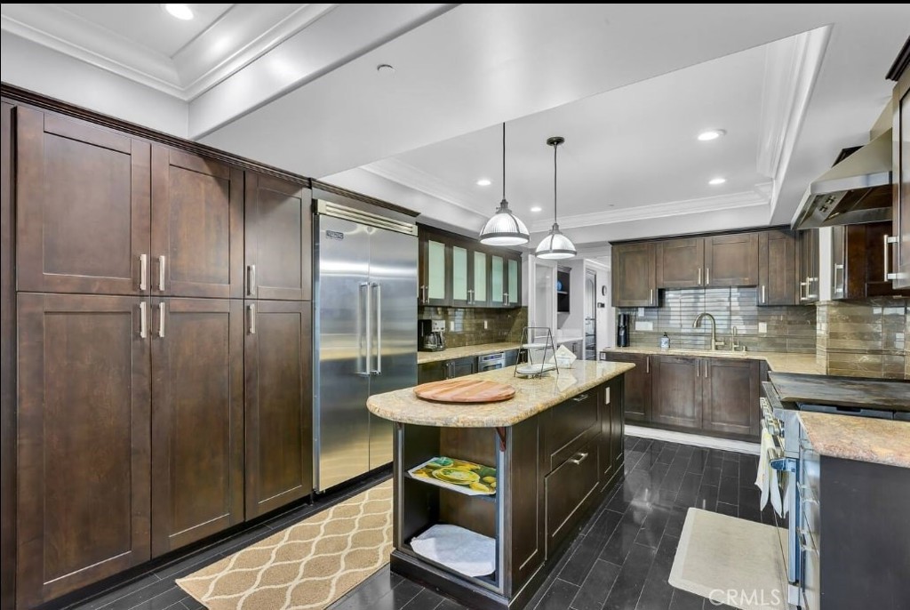155 Cordova Street, Unit 203 Pasadena, CA 91105 - Photo 26 of 57 a kitchen with a table chairs refrigerator and microwave