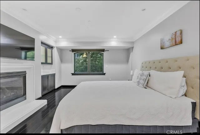 a bedroom with a bed and a table