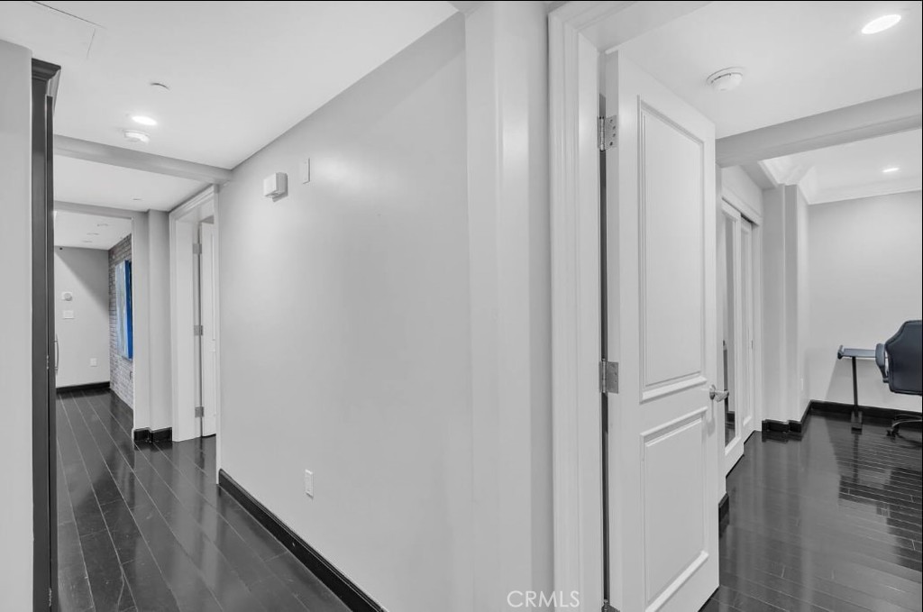 155 Cordova Street, Unit 203 Pasadena, CA 91105 - Photo 39 of 57 a view of a hallway with wooden floor and staircase
