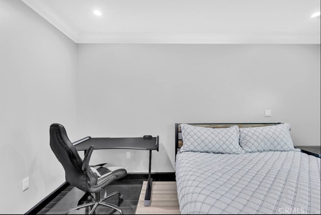 155 Cordova Street, Unit 203 Pasadena, CA 91105 - Photo 40 of 57 a bedroom with a bed and a chair