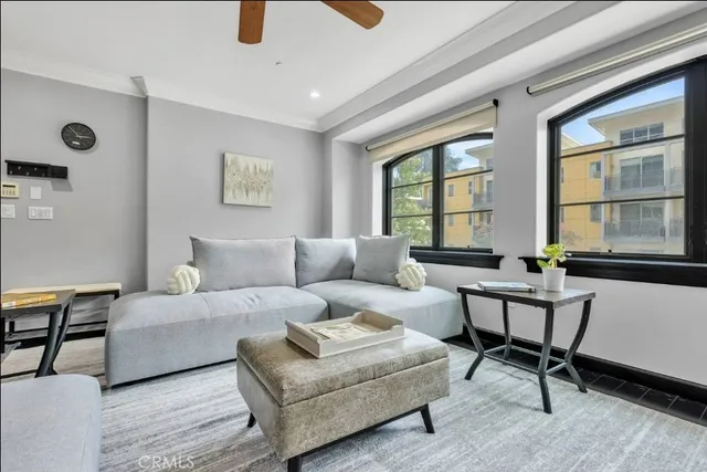 a living room with furniture and windows