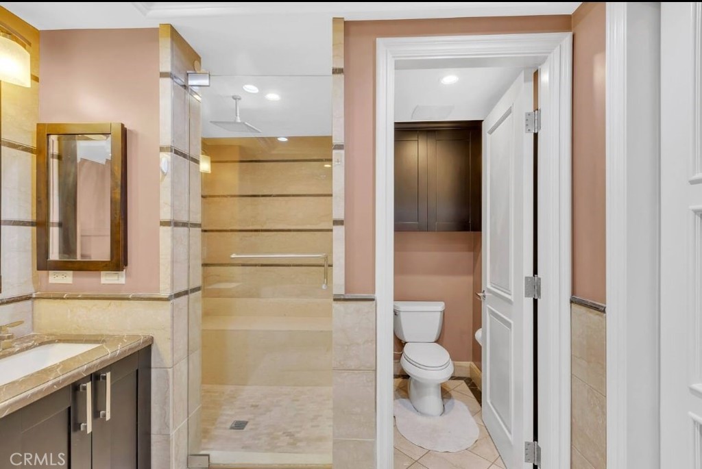 155 Cordova Street, Unit 203 Pasadena, CA 91105 - Photo 42 of 57 a bathroom with a granite countertop shower and a sink