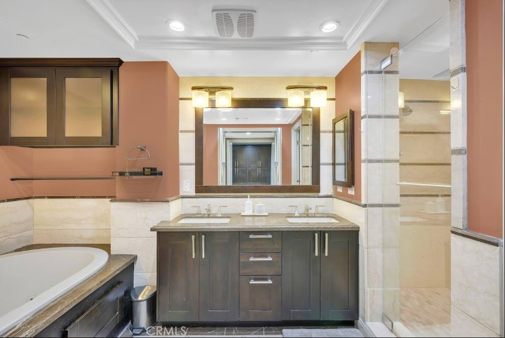 155 Cordova Street, Unit 203 Pasadena, CA 91105 - Photo 46 of 57 a bathroom with a granite countertop sink a mirror and a bathtub