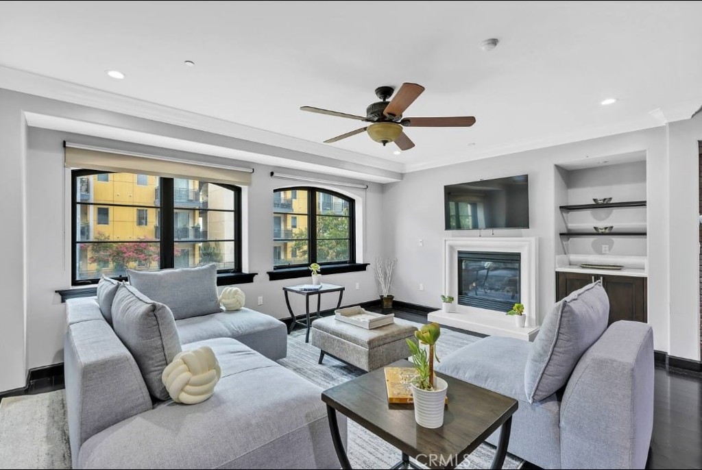 155 Cordova Street, Unit 203 Pasadena, CA 91105 - Photo 6 of 57 a living room with fireplace furniture and a large window