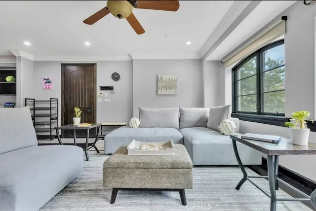 a living room with furniture and a large window