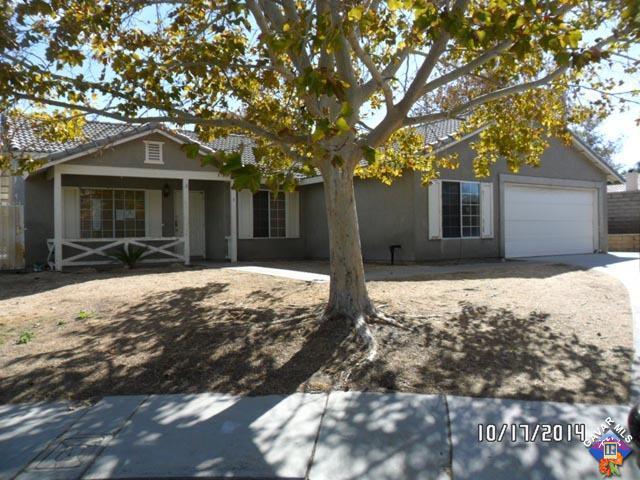 37604 Teal Street Palmdale, CA 93552 - Photo 1 of 10 a front view of a house with a yard covered in snow