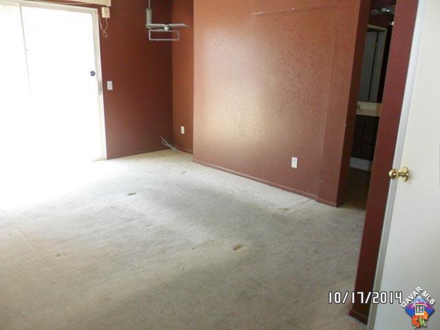 37604 Teal Street Palmdale, CA 93552 - Photo 6 of 10 an empty room with a door