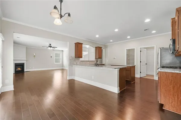 a view of kitchen with sink and wooden floor