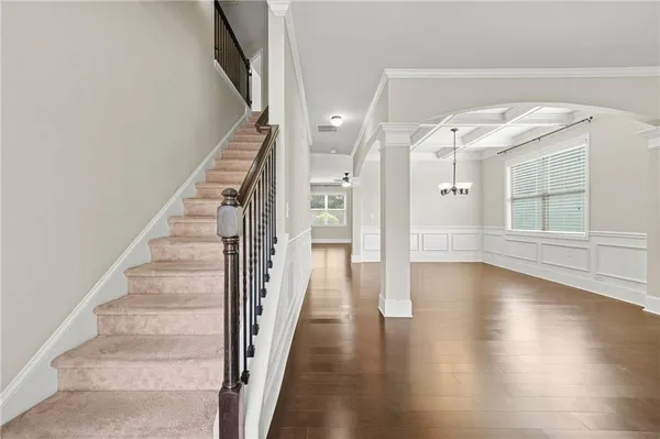 a view of an entryway with wooden floor