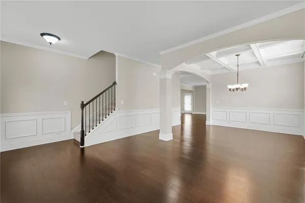 a view of an entryway with wooden floor