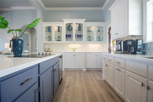 a bathroom with a light fixture a mirror and a sink