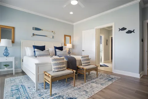 a bedroom with bed and a large mirror