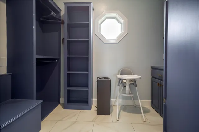 a bathroom with a sink a tub and a mirror