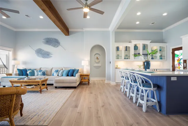 a large kitchen with a large counter top space stainless steel appliances and cabinets