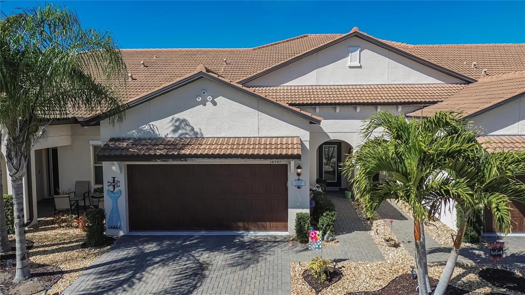16909 April Plush Drive Wimauma, FL 33598 - Photo 40 of 89 a front view of a house with a garage