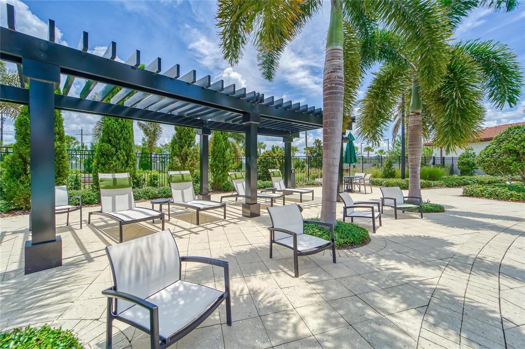16909 April Plush Drive Wimauma, FL 33598 - Photo 59 of 89 a view of a patio with a table and chairs