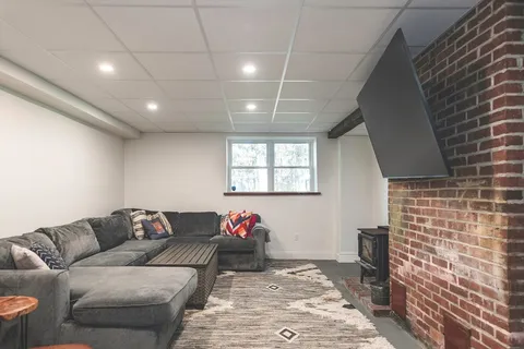 a living room with furniture and a rug