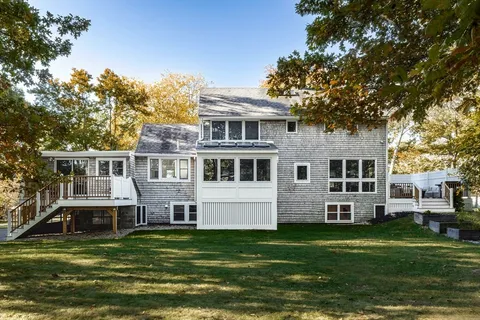 a view of a house with a yard and plants