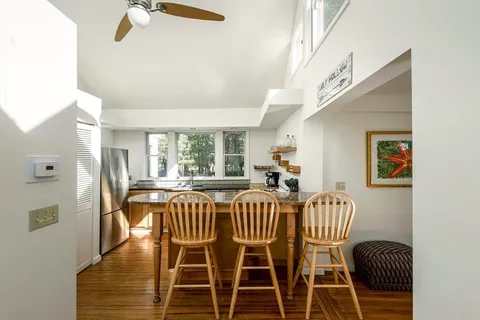 a kitchen with stainless steel appliances granite countertop a sink and a stove